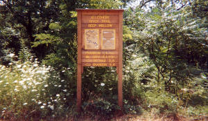 Distance sign at Deep Hollow Trail Head